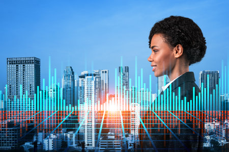 Attractive black woman trader and stock market analyst in suit dreaming about market behavior and forecast in crisis. Women in business concept. Forex chart. Bangkok. Double exposure.の写真素材