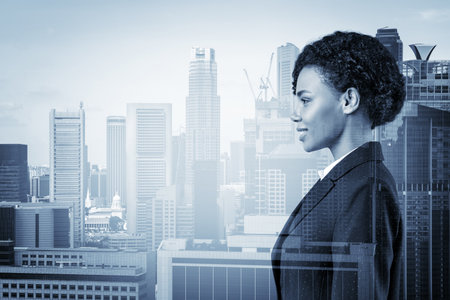 Successful smiling black African American business woman in suit. Singapore cityscape. The concept of woman in business. Legal consultant. Double exposure.の写真素材