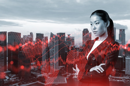 Attractive young Asian trader and stock market analyst in suit dreaming about market behavior and forecast in crisis. Women in business concept. Forex chart. Singapore. Double exposure.の写真素材