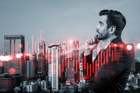 A young Caucasian handsome trader and stock market analyst in suit dreaming about market behavior and forecast in crisis. Trading at corporate finance fund. Forex chart. Bangkok. Double exposureの写真素材