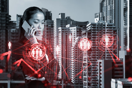 Attractive Asian businesswoman processing conference call to develop social media marketing strategy...