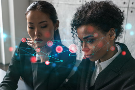 Two businesswomen work together in modern office on new project. Double exposure. Concept of...