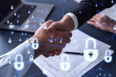 Handshake of two businessmen who enters into the contract to protect cyber security of international company. Padlock Hologram icons over the table with documents.の写真素材