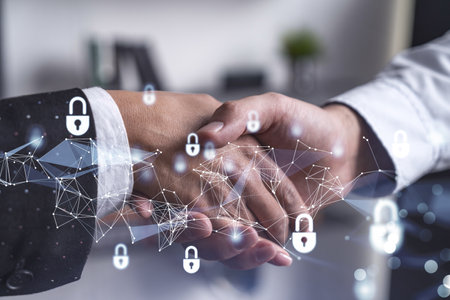 Handshake of two businesspeople who are negotiated the project to protect cyber security of international company. Padlock Hologram icons. Woman in business.の写真素材