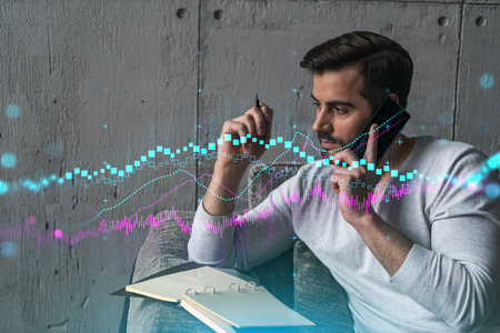 Handsome trader in casual long sleeve talking phone, taking notes at office workplace try to find the best capital market solution. Double exposure. Internet trading at FOREX exchange.の写真素材