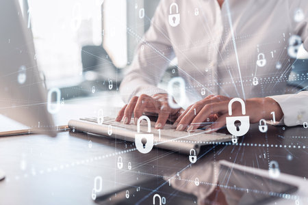 A woman programmer is typing a code on computer to protect a cyber security from hacker attacks and...
