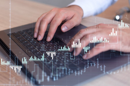 Hands typing the keyboard to research stock market to proceed right investment solutions. Internet...