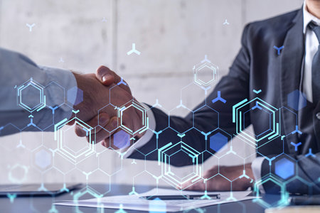 Handshake of two businessmen who enters into the contract to develop a new software to improve business service at a company. Technological icons over the table with the document.の写真素材