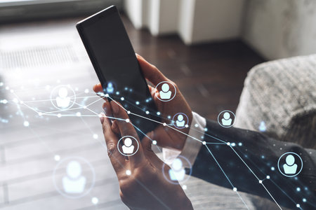 HR woman specialist in formal wear browsing social networks in the Internet in smart phone to find...