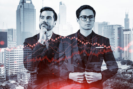 Two young handsome businessman in suits dreaming about new career opportunities after MBA graduation. Trading at corporate finance fund. Forex chart. Kuala Lumpur on background. Double exposure.の写真素材