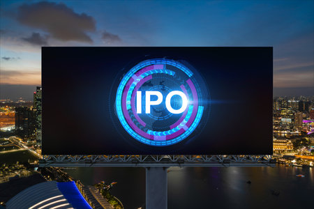IPO icon hologram on road billboard over night panorama city view of Singapore. The hub of initial public offering in Southeast Asia. The concept of exceeding business opportunities.の写真素材