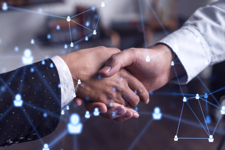 Recruitment concept of hiring of a new talented specialists for international company. Handshake as a concept of agreement to sign an employment contract. Social media hologram icons.の写真素材