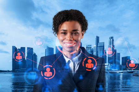 Smiling black woman HR director at international company is thinking about recruitment of highly...