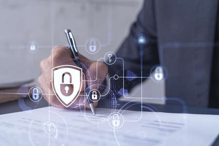 A businessman in formal wear signing the contract to prevent probability of risks in cyber security....