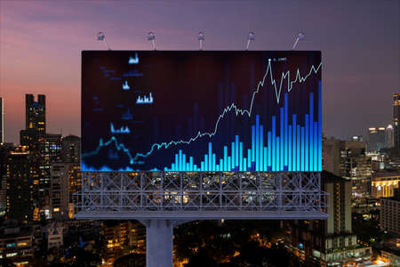 FOREX graph hologram on billboard, aerial night panoramic cityscape of Bangkok. The developed...