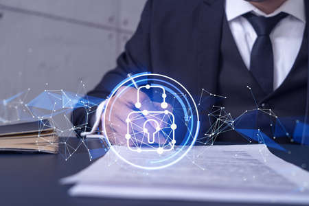 A businessman in formal wear signing the contract to prevent probability of risks in cyber security....