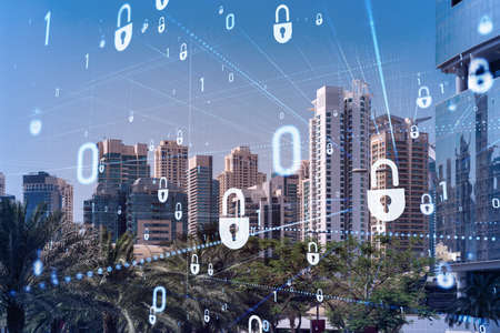 Panoramic view skyscrapers. Modern cityscape of the capital of the Emirate of Dubai. Financial services hub. Information security concept. Lock icon. Double exposure.の写真素材