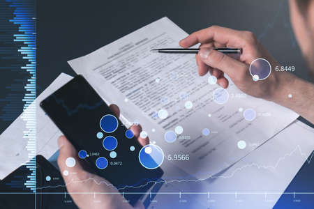 A client in casual wear is signing the contract to invest money in stock market. Internet trading...