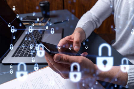 A programmer is browsing the Internet in smart phone to protect a cyber security from hacker attacks...