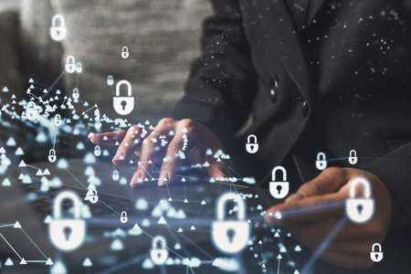 A woman programmer is typing a code on computer to protect a cyber security from hacker attacks and...