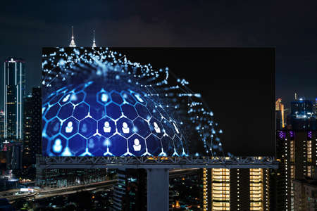 Glowing Social media icons on billboard over night panoramic city view of Kuala Lumpur, Malaysia,...