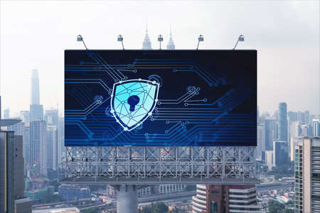 Padlock icon hologram on road billboard over panorama city view of Kuala Lumpur at day time to...