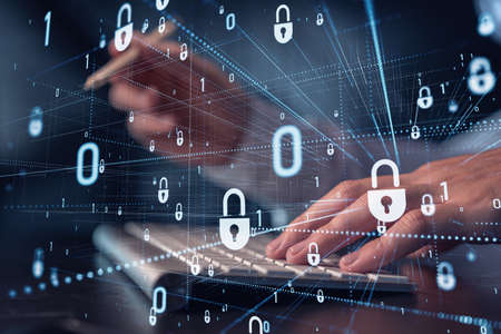 A programmer is typing a code on computer to protect a cyber security from hacker attacks and save...