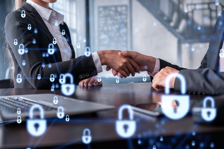 Handshake of two businesspeople who are negotiated the project to protect cyber security of international company. Padlock Hologram icons. Woman in business.の写真素材