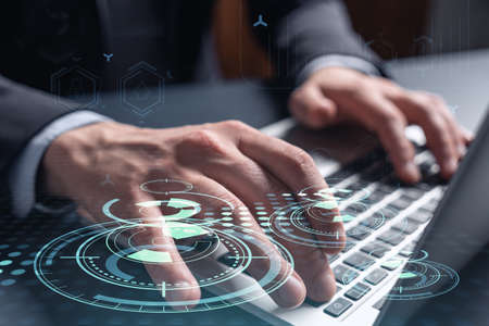Hands typing the keyboard to create innovative software to change the world and provide a completely...
