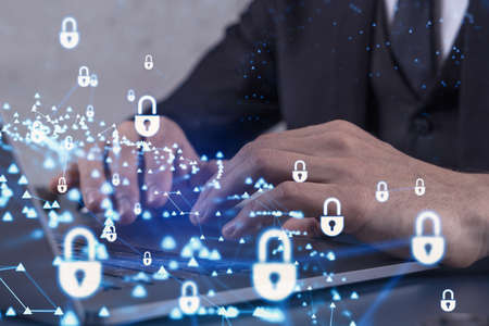 A programmer is typing a code on computer to protect a cyber security from hacker attacks and save...