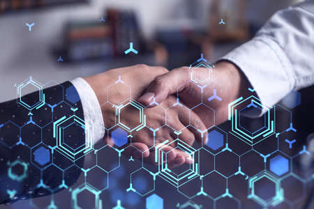 Handshake of two businesspeople as agreement concept to develop a new software to improve service at...