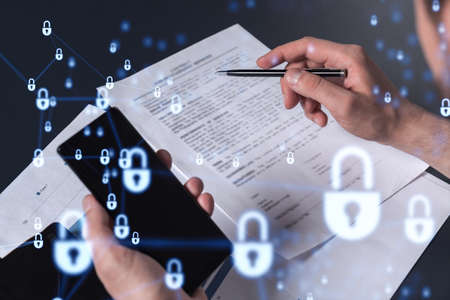 A businessman in casual wear signing the contract to prevent probability of risks in cyber security....