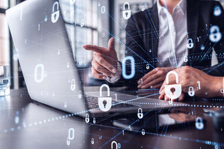 Two business people working on the project to protect cyber security of international company using...