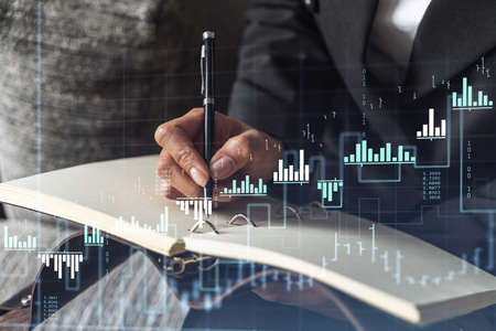 A woman trader in formal wear writing down some ideas to research stock market to proceed right...