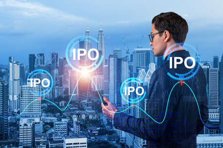 Eastern successful analyst in suit checking the worldwide news using smartphone to set up effectively IPO to ensure the client new opportunities. Initial Public Offering. Kuala Lumpurの写真素材