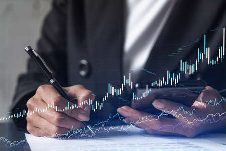 Businesswoman in formal wear is signing the contract to invest money in stock market. Internet...