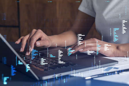 Woman hands typing the keyboard to research stock market to proceed right investment solutions. Internet trading and wealth management concept. Casual wear. Hologram Forex chart over close up shotの写真素材