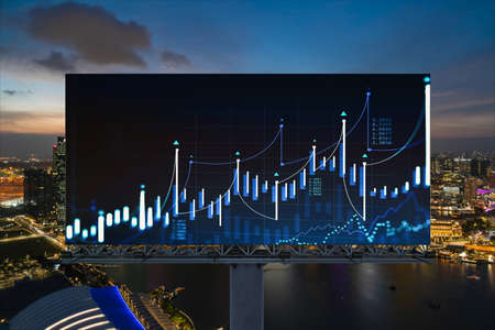 FOREX graph hologram on billboard, aerial night panoramic cityscape of Singapore. The developed location for stock market researchers in Southeast Asia. The concept of fundamental analysisの写真素材