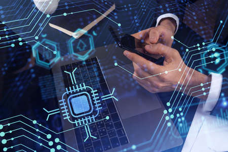 Programmer holding in the hands a smart phone and testing an innovative application to provide a...