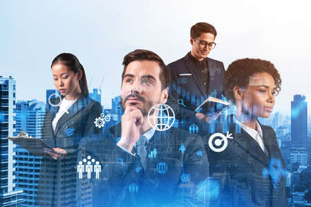 Group of business colleagues trying to find new tech approaches to solve problems at research and development department. Fintech hologram icons over Bangkok background.の写真素材