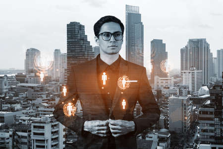 Handsome eastern HR director at international company is thinking about efficient strategy to...