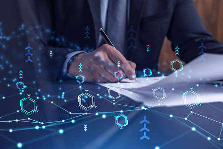 A client in dark blue suit is signing a contract to create a new software to present it in start up...