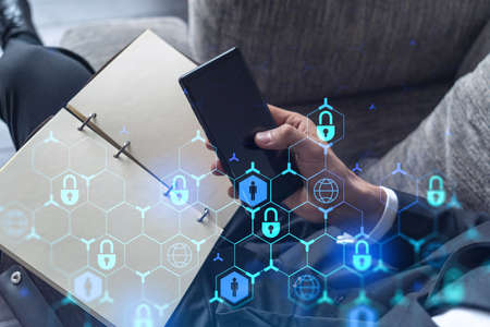 A programmer is browsing the Internet in smart phone to protect a cyber security from hacker attacks...