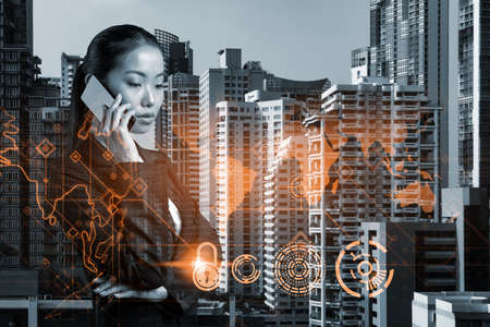 Attractive Asian cybersecurity developer having conference call to protect clients confidential...