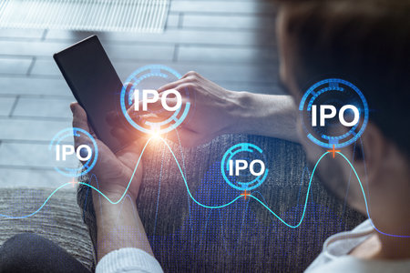 A man using smart phone. Double exposure. IPO symbol hologram. Initail primary offering concept.の写真素材