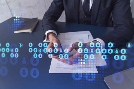 A potential employee in formal wear reading the contract to boost his career and gain new...