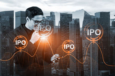 Eastern successful analyst in suit checking the worldwide news using smartphone to set up effectively IPO to ensure the client new opportunities. Initial Public Offering. Singaporeの写真素材