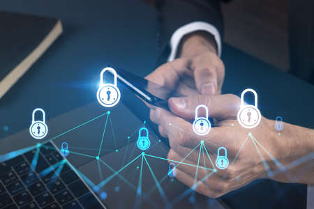 Businessman using on-line app on phone. Lock hologram. Multiexposure. Internet security concept.