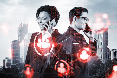 Businessman and businesswoman as a part of corporate team processing conference call to develop...