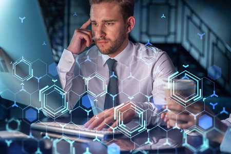 Two colleagues in formal wear working together to optimize business process by applying new...